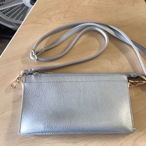 Silver bag with 3 sections.